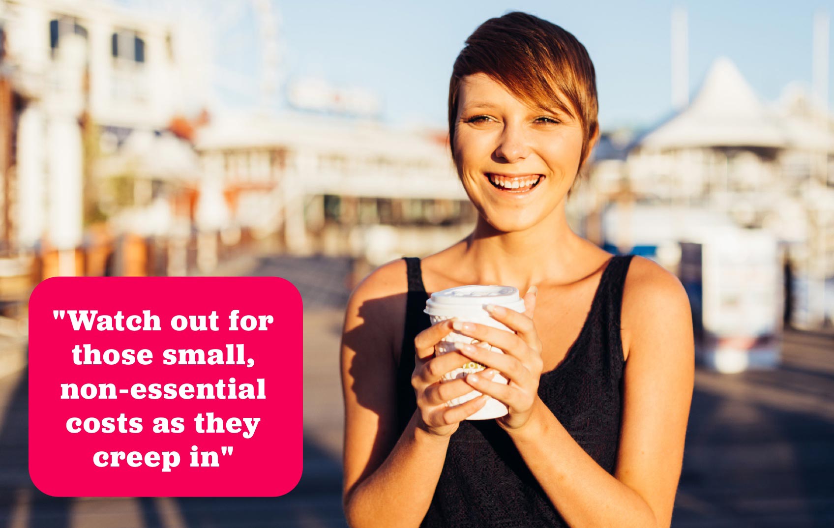 Young girl stands outside in the sunshine holding her takeaway coffee cup